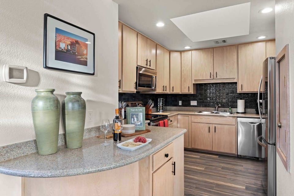 Kitchen area with stainless steel appliances.