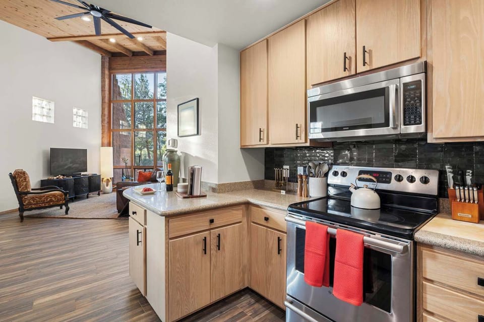 Kitchen area adjacent to the open living room space.