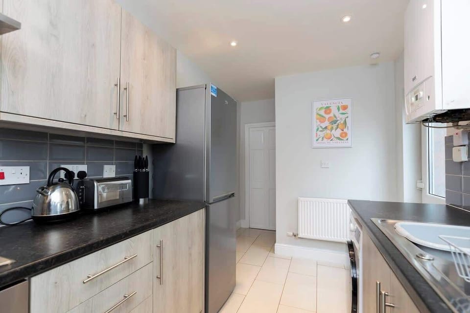 With all the necessary amenities, including a washing machine, this kitchen is ready for your culinary adventures and everyday needs
