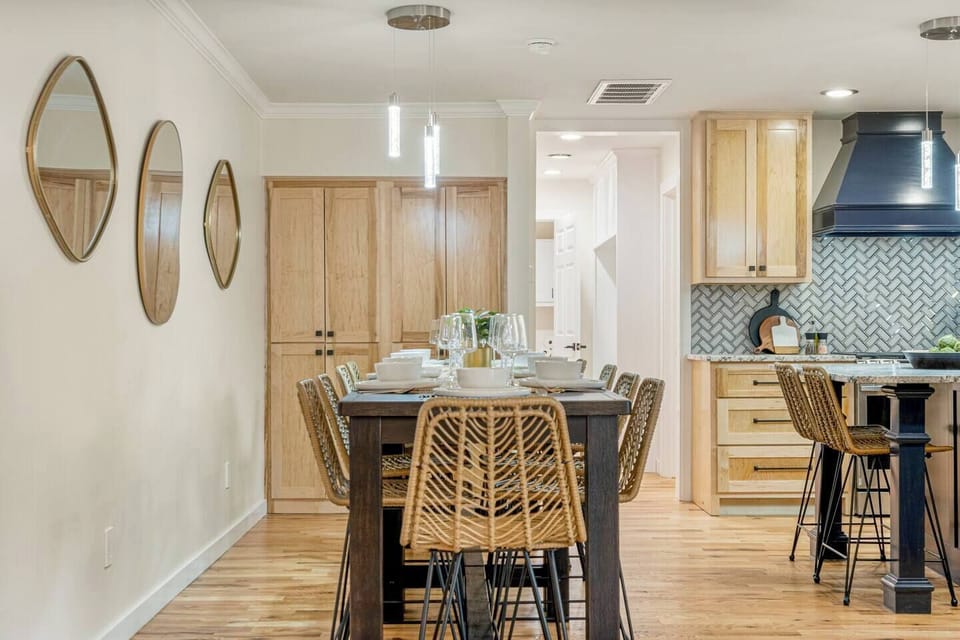 Dining area - seating for 10 at dining table. 2 more seats at kitchen island. 