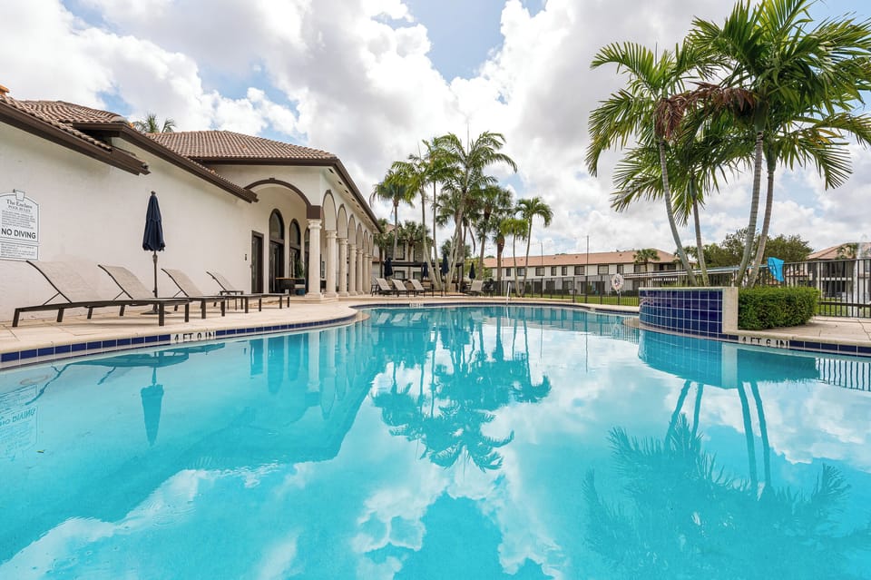 Heated pool with chairs and umbrellas!