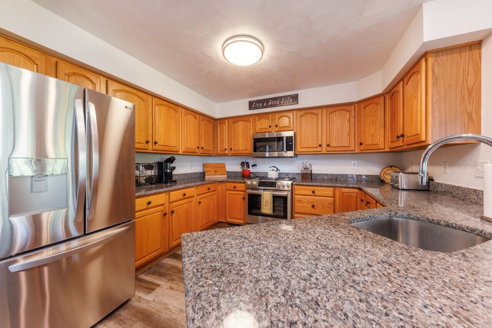 The chef's kitchen is the perfect place to cook delicious meals and entertain your guests. Equipped with top-of-the-line appliances and ample counter space, it makes meal preparation a delightful experience.