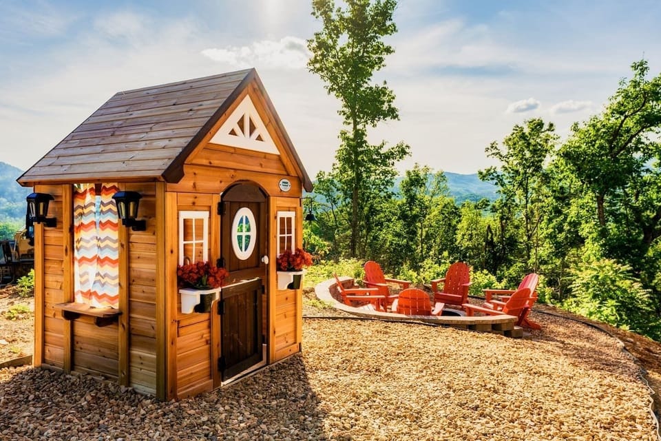 The mini-cabin for the little ones to call their own!  Plus, the fire pit beyond.  Both with amazing views.   Bear Mountain Vista cabin.