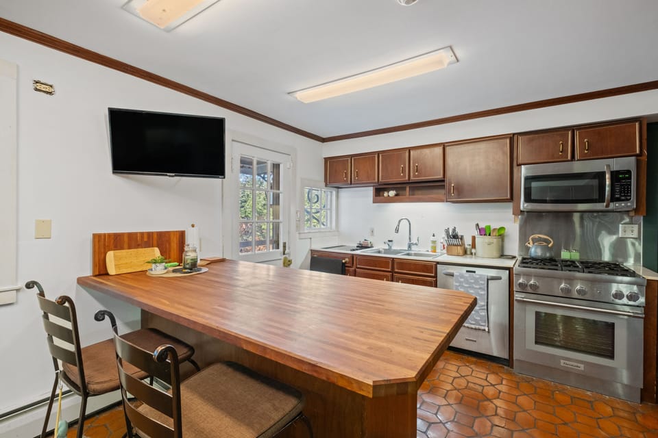 Full kitchen with gas range, dishwasher, microwave, coffee maker, fridge, etc.