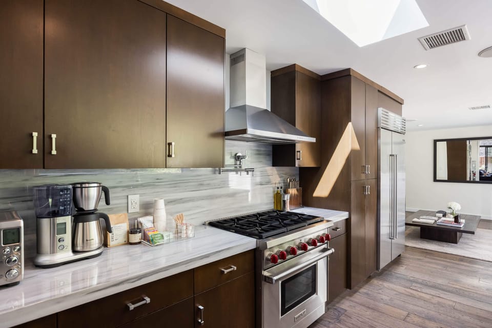 Cook up culinary delights on the modern stove and appliances, ensuring a seamless cooking experience.