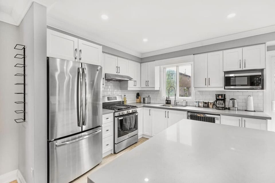 Welcome to a kitchen ready for your culinary adventures. With its gleaming stainless steel appliances and bright, open design, this space is thoughtfully equipped for your every need. Whether you`re whipping up a quick breakfast or preparing a gourmet mea