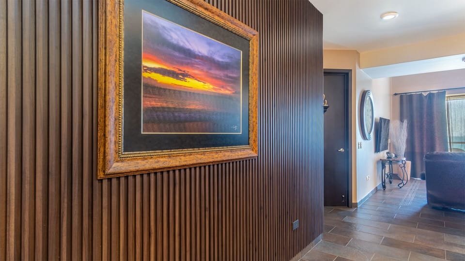 Stylish wood paneled wall as you enter the unit
