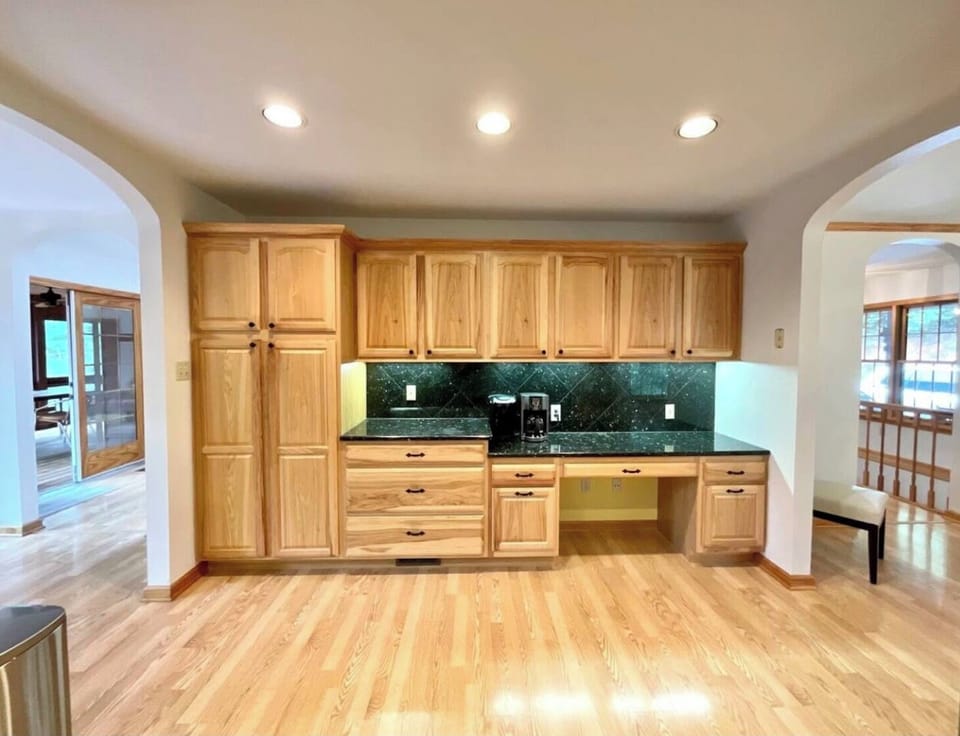 Kitchen with breakfast nook/office to left and large dining room on right