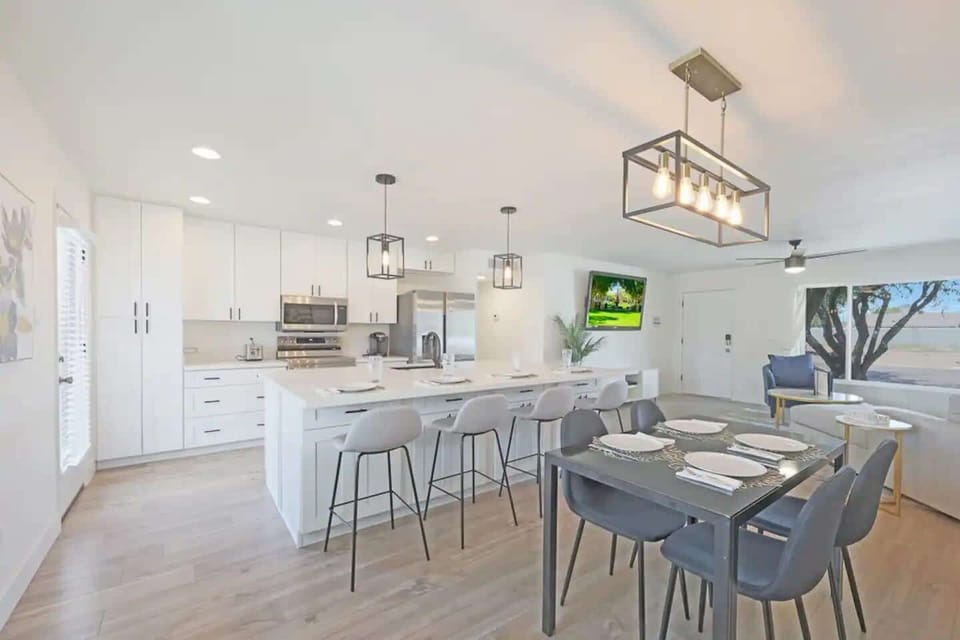 Whether you prefer to sit at the kitchen table or the kitchen island, the open kitchen design is great for keeping everybody together!