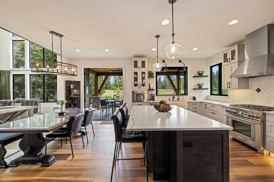 Chef’s Kitchen, Oversized Island + Indoor/Outdoor Dining Flow