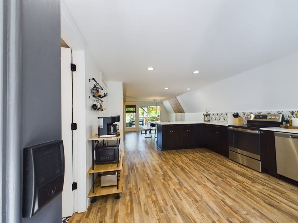 The main level of the A Frame is an open space design between the kitchen, dining and living areas.