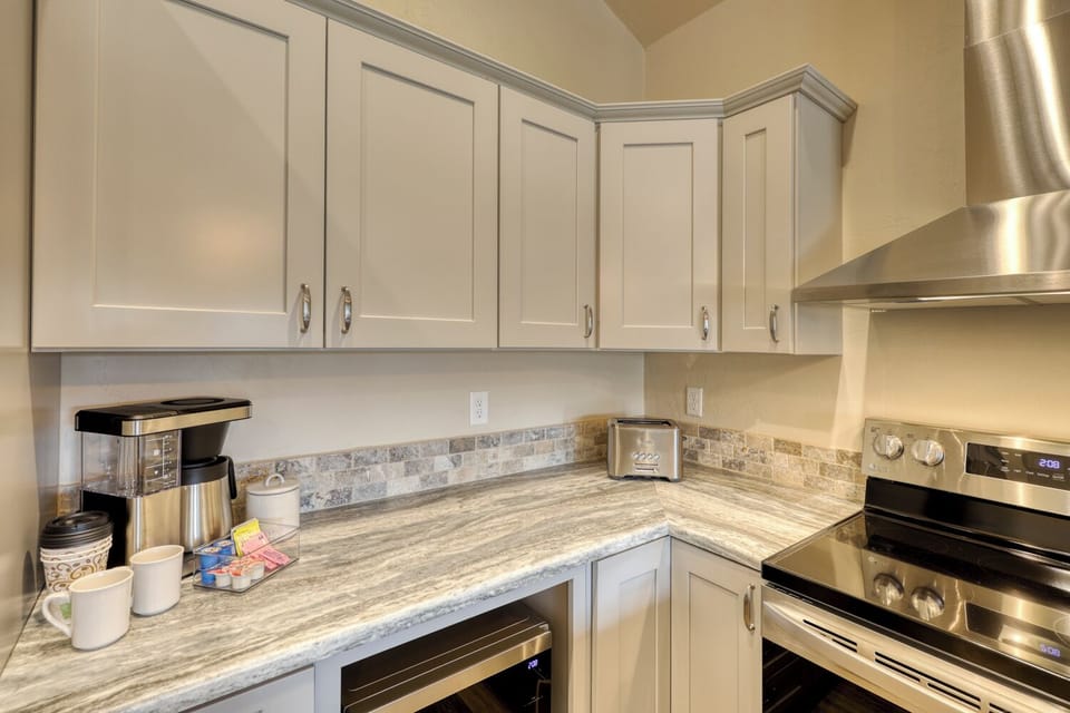 Kitchen with modern appliances, ample counter space, and high-quality essentials, makes meal preparation effortless and enjoyable.