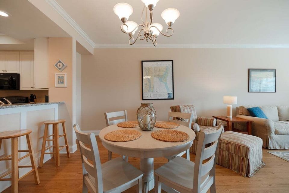 Open dining area conveniently connected to the kitchen and living room, creating the perfect layout for entertaining and group meals.
