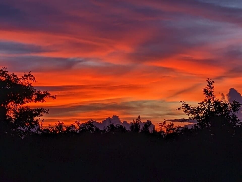 Amazing sunset taking by one of our guests   From the patio or pool side .