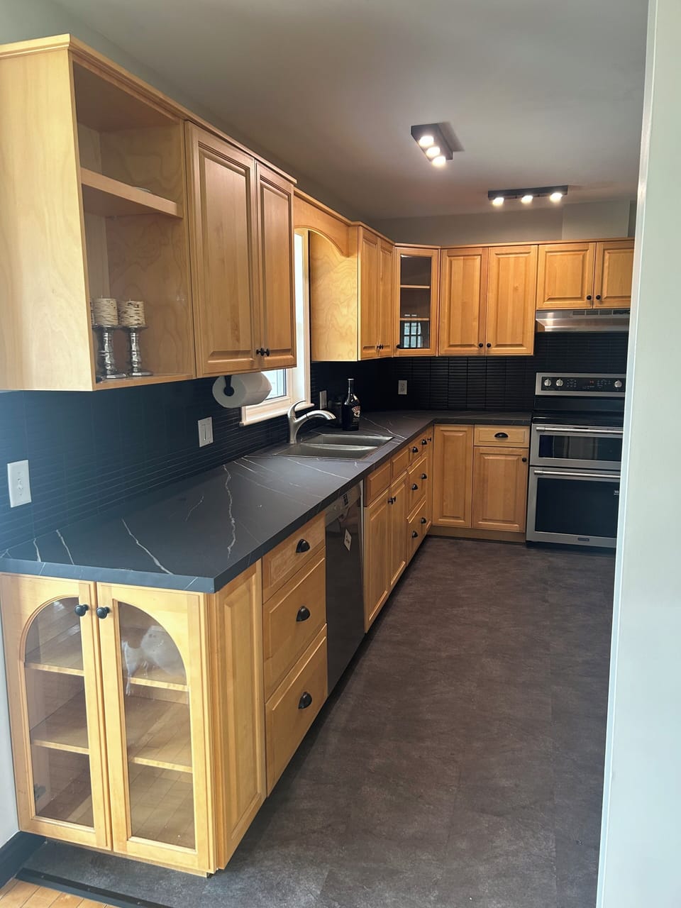 Our kitchen has a full size fridge, double oven, microwave, & deep freeze.