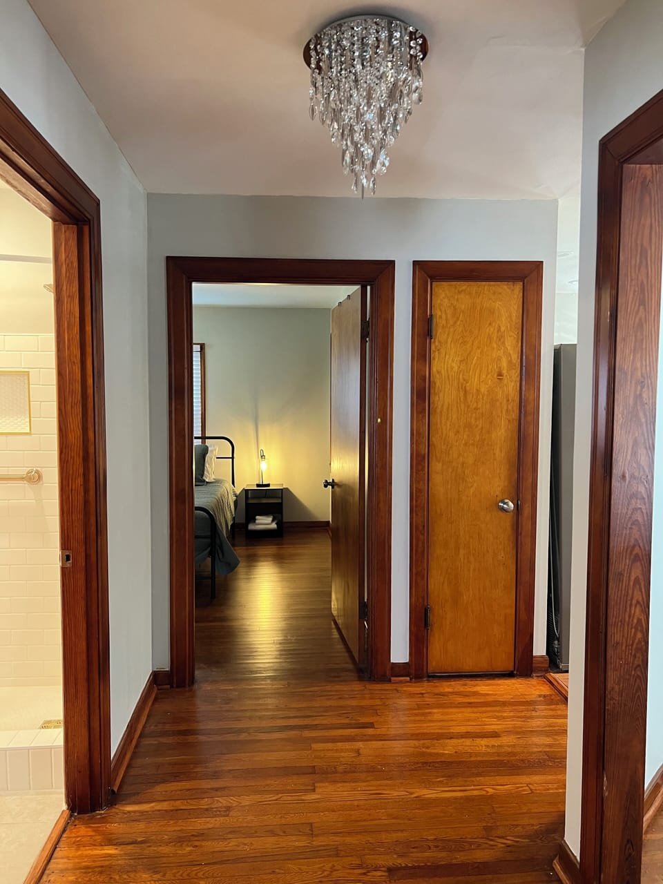 Hallway area between bedrooms, bathroom to the left