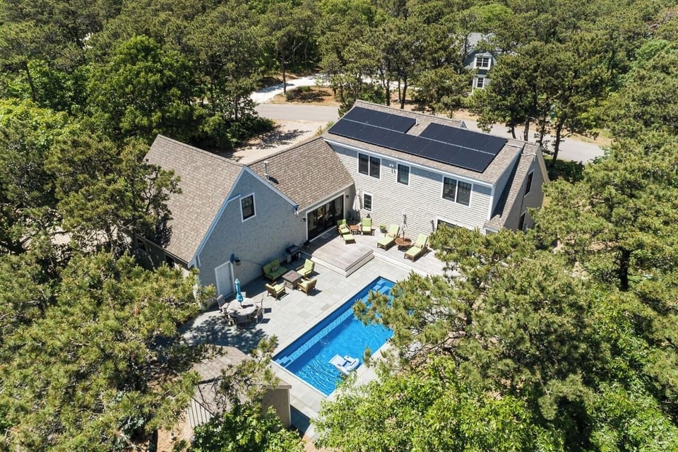 Aerial view of back yard and house. Very private and lush with pine/oak trees