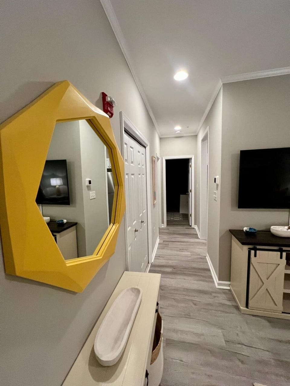 Hallway that leads to the second bedroom , the master bedroom its on the other side of the kitchen providing privacy. 