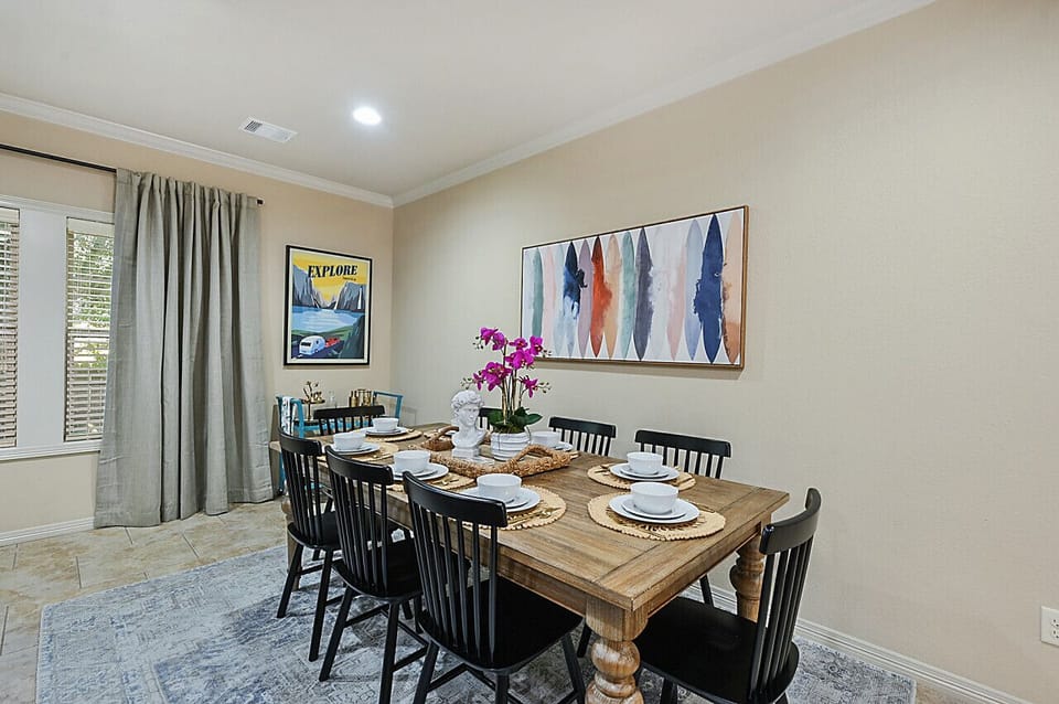 Spacious dining area, seats eight comfortably, ideal for family gatherings.