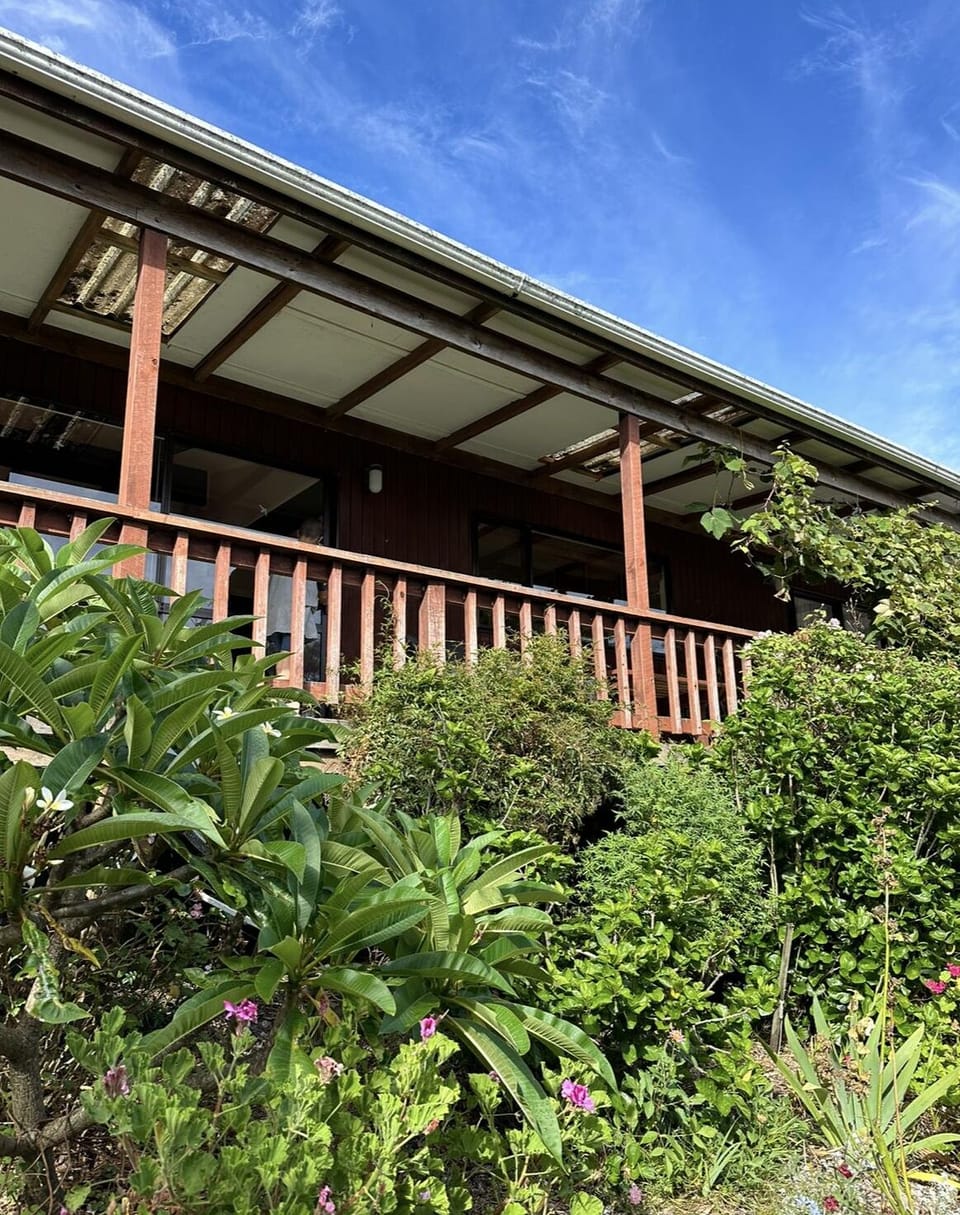 Deck overlooking tropical gardens and Hokianga Harbour