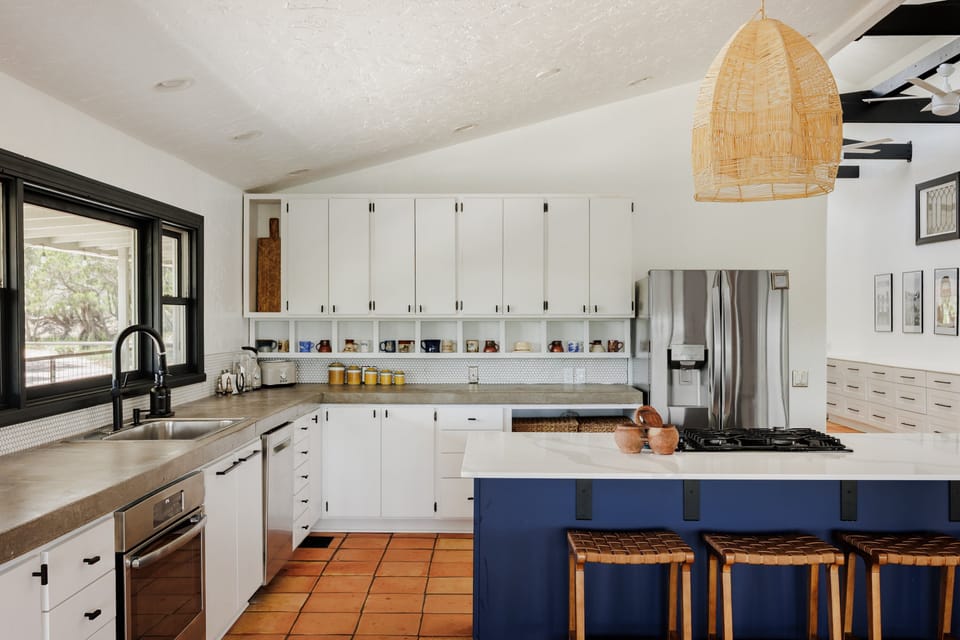 Open kitchen showcases stylish stainless-steel appliances