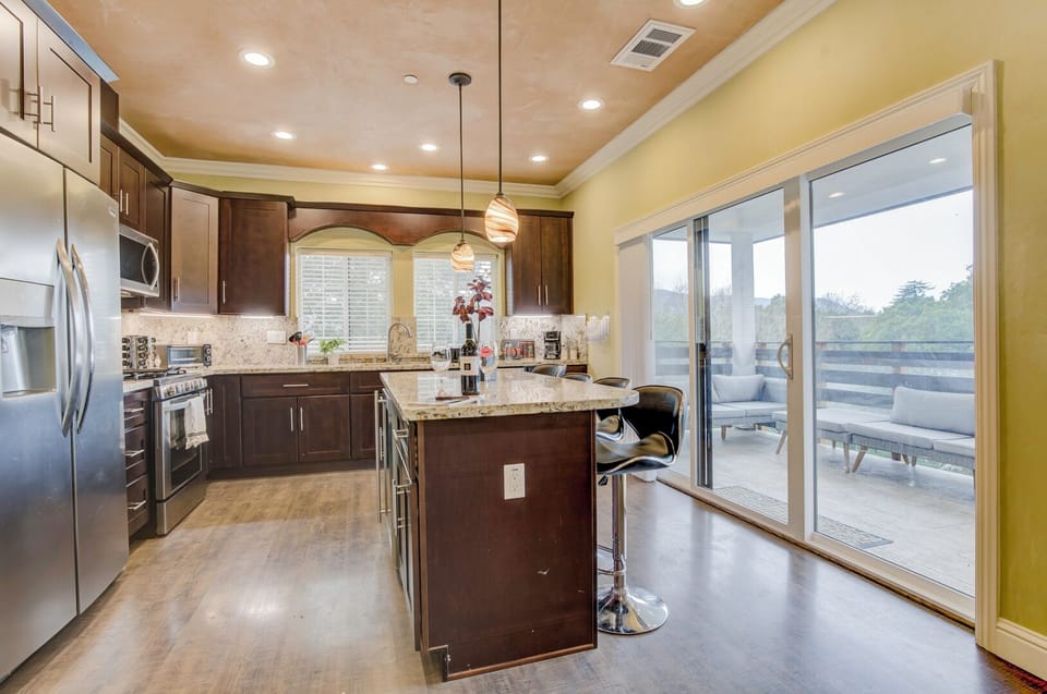 Upstairs Kitchen with Kitchen Island & Stainless Steel Appliances