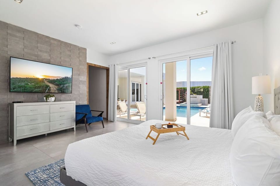 Relax with loved ones in our bedrooms, featuring premium TVs for your entertainment.
