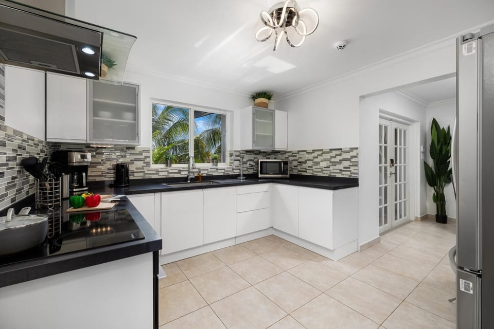 Whip up culinary delights in our spacious kitchen, equipped with modern appliances and ample counter space. Dining here is an experience to savor.