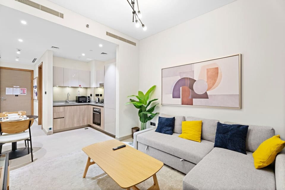 Living Room: Stylish open space with modern decor, sunny vibes, and a view of your Dubai adventure!