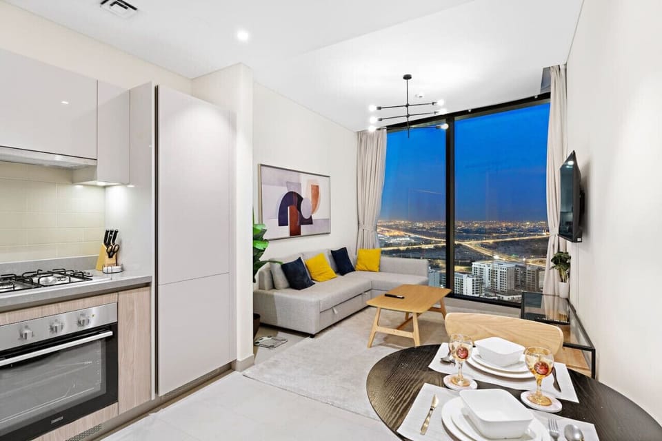 Living Room: Stunning skyline views paired with modern decor for your ultimate getaway!