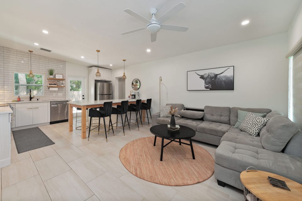 Your mid-century modern oasis awaits you! With this open floor plan, you are able to relax, cook, watch tv, etc all together as a family or group!