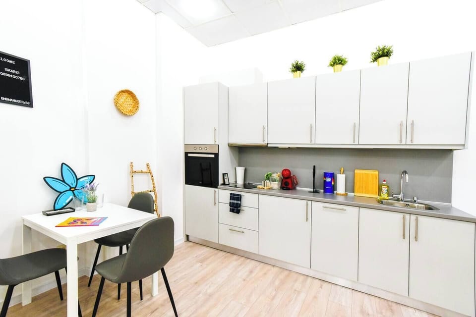 Cook up your favorite meals in this fully equipped kitchen that has everything you need for a comfortable stay. With modern appliances, including an oven and coffee/tea facilities, preparing meals or a morning cup of coffee will be a breeze. The cozy dining area is perfect for enjoying a meal or planning your next adventure in Sofia. Whether you’re staying in for a quiet night ...