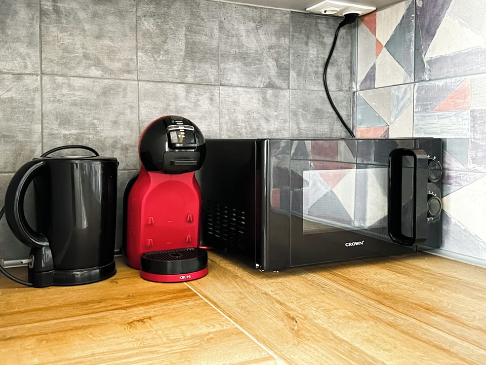 Your Morning Boost! Start your day with the perfect cup from the Dolce Gusto coffee machine, or enjoy a quick snack using the microwave and kettle. Book Now and wake up to comfort and convenience!