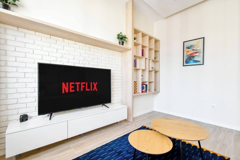 Contemporary meets comfort: A blend of modern design and homely touches, with a smart TV and comfortable seating.