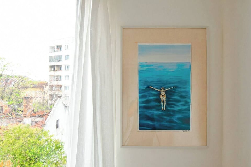 You’ll appreciate the artistic details that bring character to the room, offering a cozy and thoughtful touch to your stay.