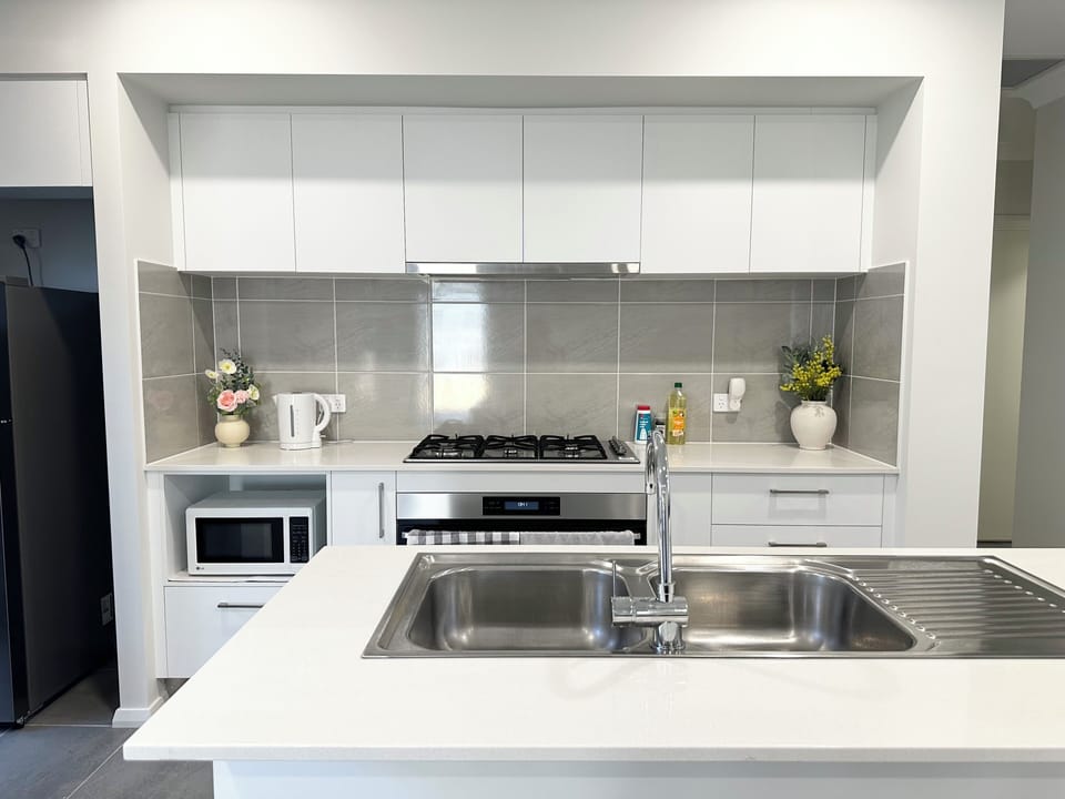 Fully equipped modern kitchen with stainless steel appliances