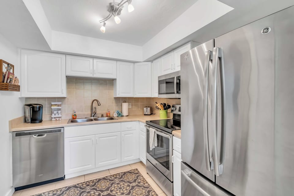 The bright kitchen is clean and equipped with everything you need!