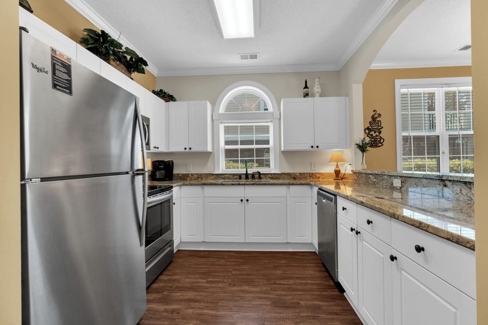 Granite countertops & Stainless Steel appliances.