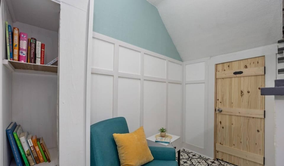 Small reading nook for those bedtime stories or some relaxing time.  The door pictured is cleaner closet.