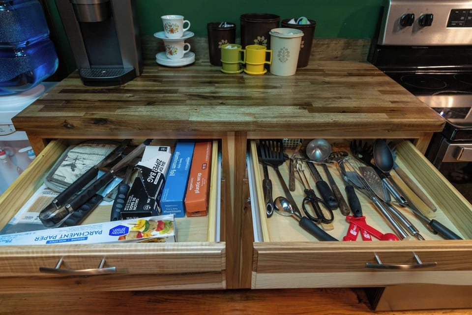 Cooking utensils and food wrap
Coffee bar includes coffee, tea, sugar and creamer.