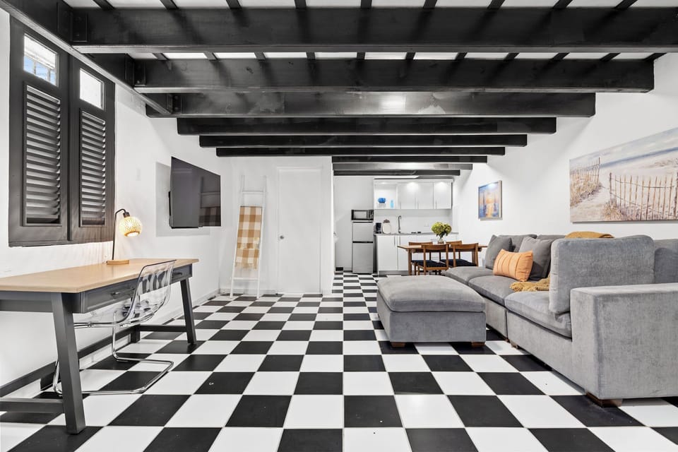 The living room has ample seating in the comfortable sofa.