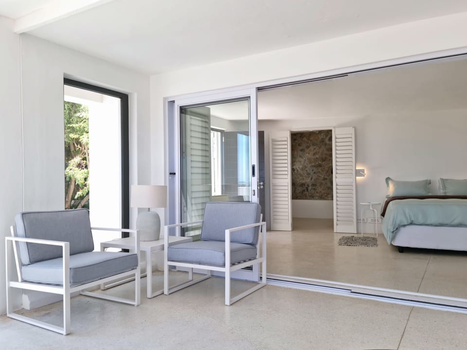 The living room with direct access into the bedroom