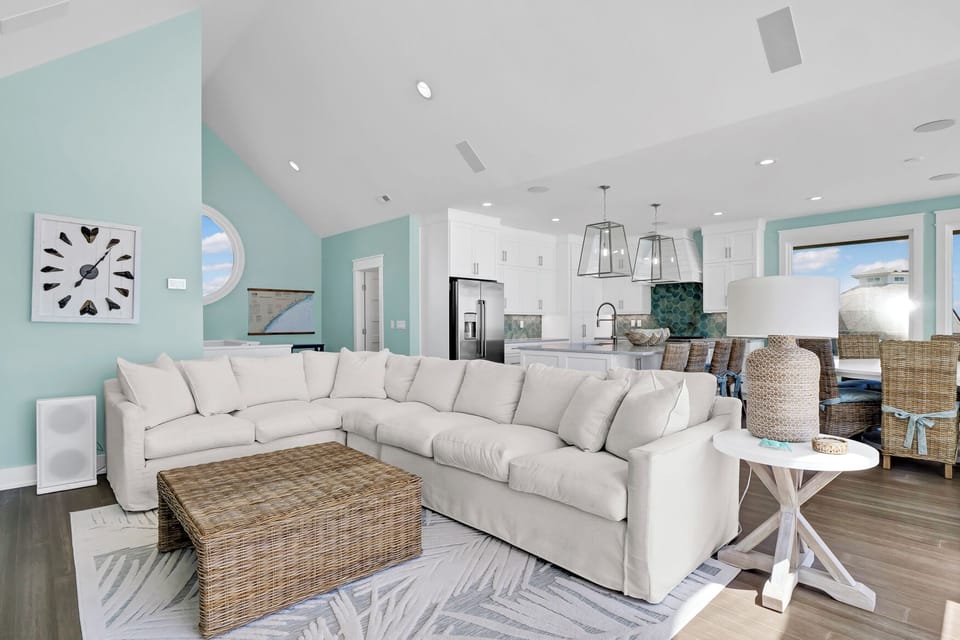 living area that offers plenty of seating with amazing oceanfront views