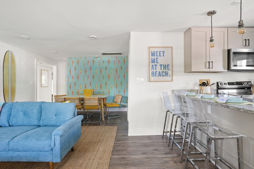 Open concept area featuring living room and kitchen