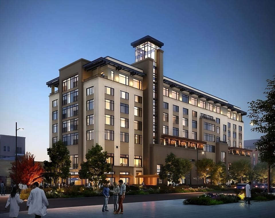 Step into an elegant hotel tower glowing at twilight.