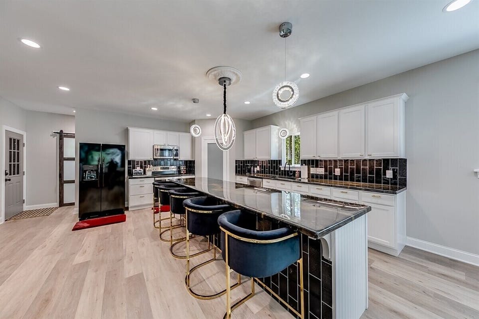 Kitchen with Large Island  & 5 chairs  - cooking is on terrace level kitchen