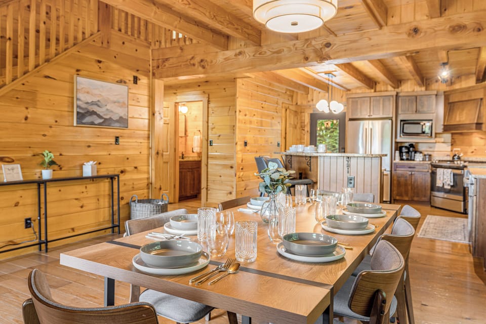 Open dining area with rustic wood decor, perfect for family meals & gatherings.