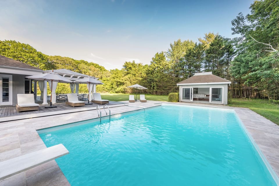 Pool house outfitted with sliding doors -perfect for taking a Zoom call