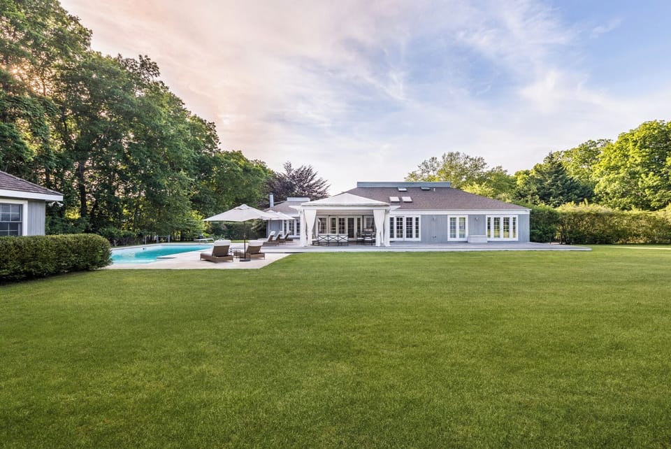 Property is privately fenced  with large front lawn, south facing 20 X 40 pool 