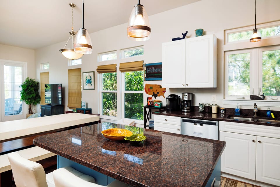 Your spacious kitchen features granite countertops, modern appliances, and abundant natural light for memorable meal preparation.